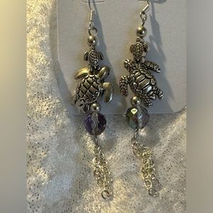 Turtles (Momma & Baby) dangling down the neck. Beautiful Conversation piece!